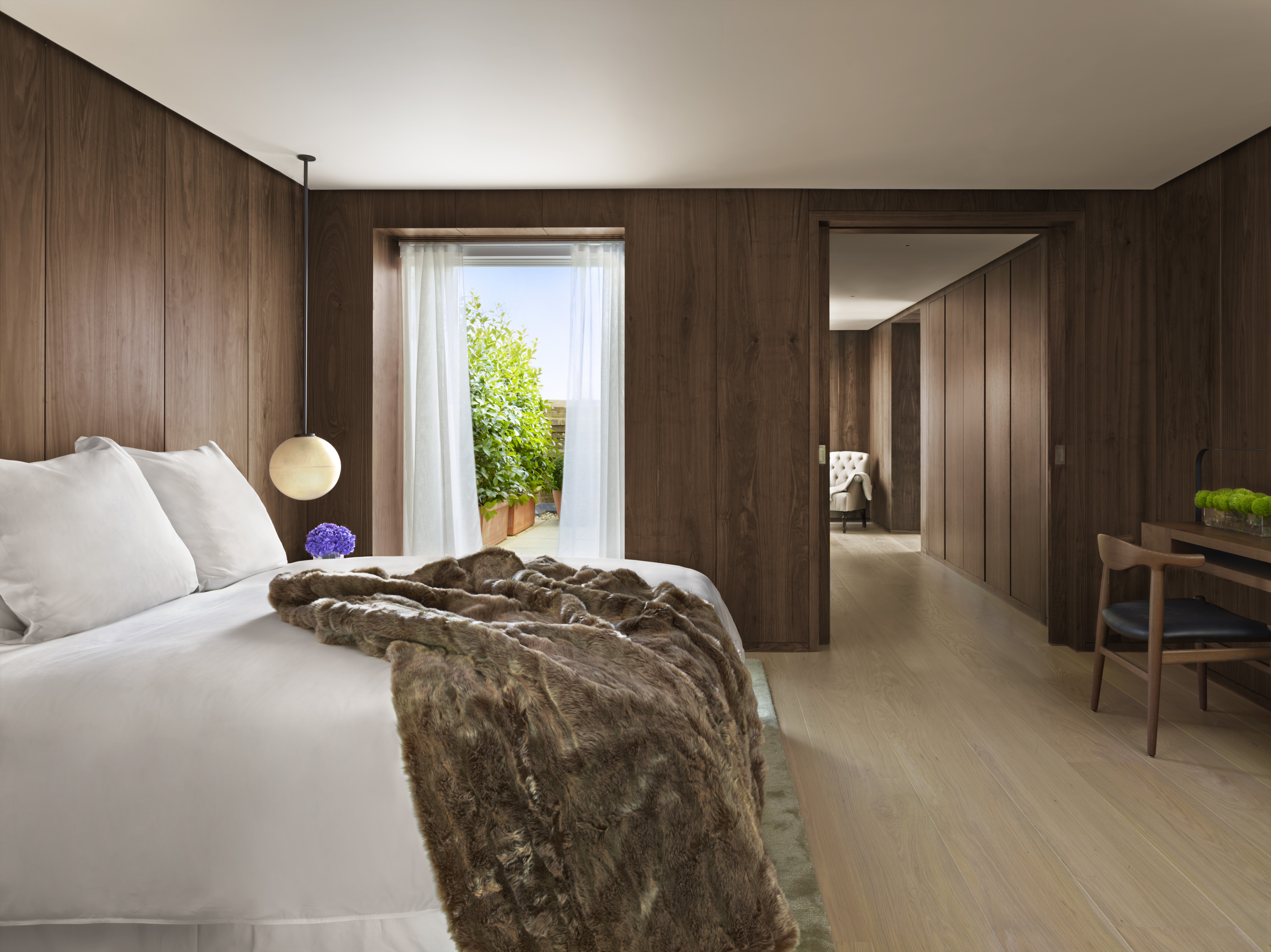 Simple lines make a dramatic impact in the Penthouse bedroom.
